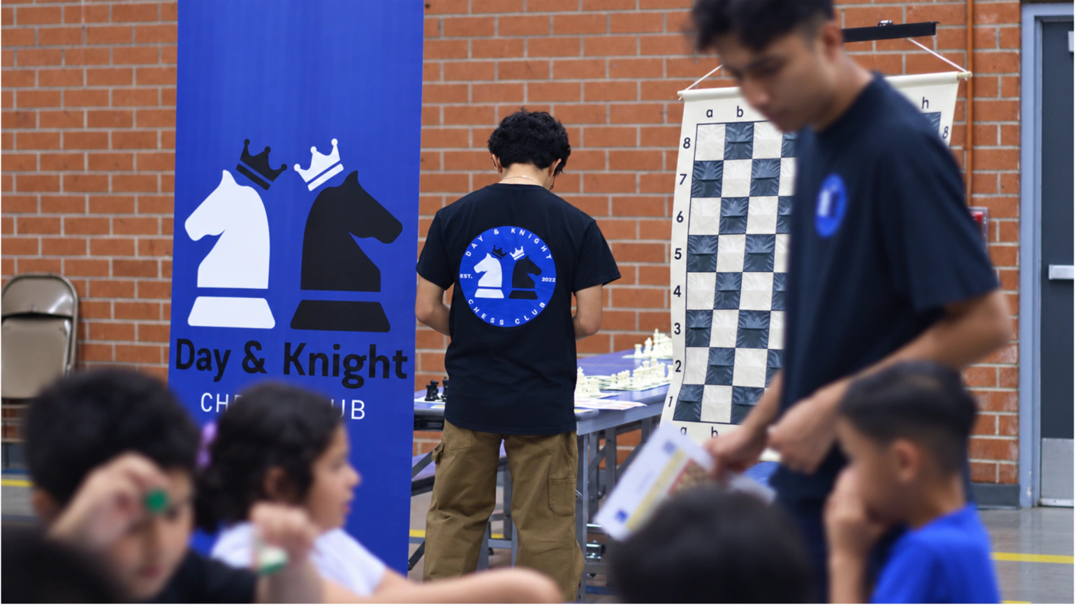 Students at a Day & Knight Chess Club event